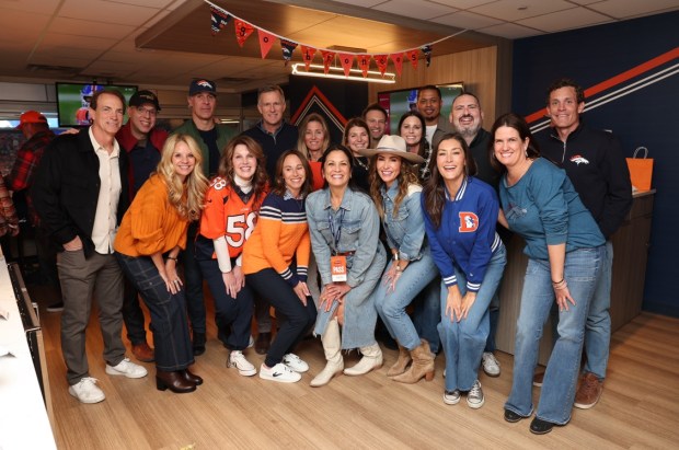 The Holiday Huddle participants gathered at a recent Broncos game. Those pictured are Avs president Joe Sakic, Avs GM Chris MacFarland, Avs coach Jared Bednar, Summit GM Curt Johnson, Susan Johnson, Allie Tenzer, Nuggets GM Ben Tenzer, Jenny Adelman, Nuggets GM Jon Wallace, Tim Gelt (Holiday Huddle), Mammoth GM Brad Self. (From left to right, front row) Debbie Sakic, Susan Bednar, Chandra MacFarland, Barb Paton, Skylene Montgomery, Alicia Self, Nicole Breheny (Holiday Huddle). Caption Denver Broncos